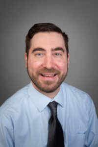 Professional headshot photo of Brian Armstrong, the Metro North Adult Autism Resource Specialist out of the Adult Autism Support Center.