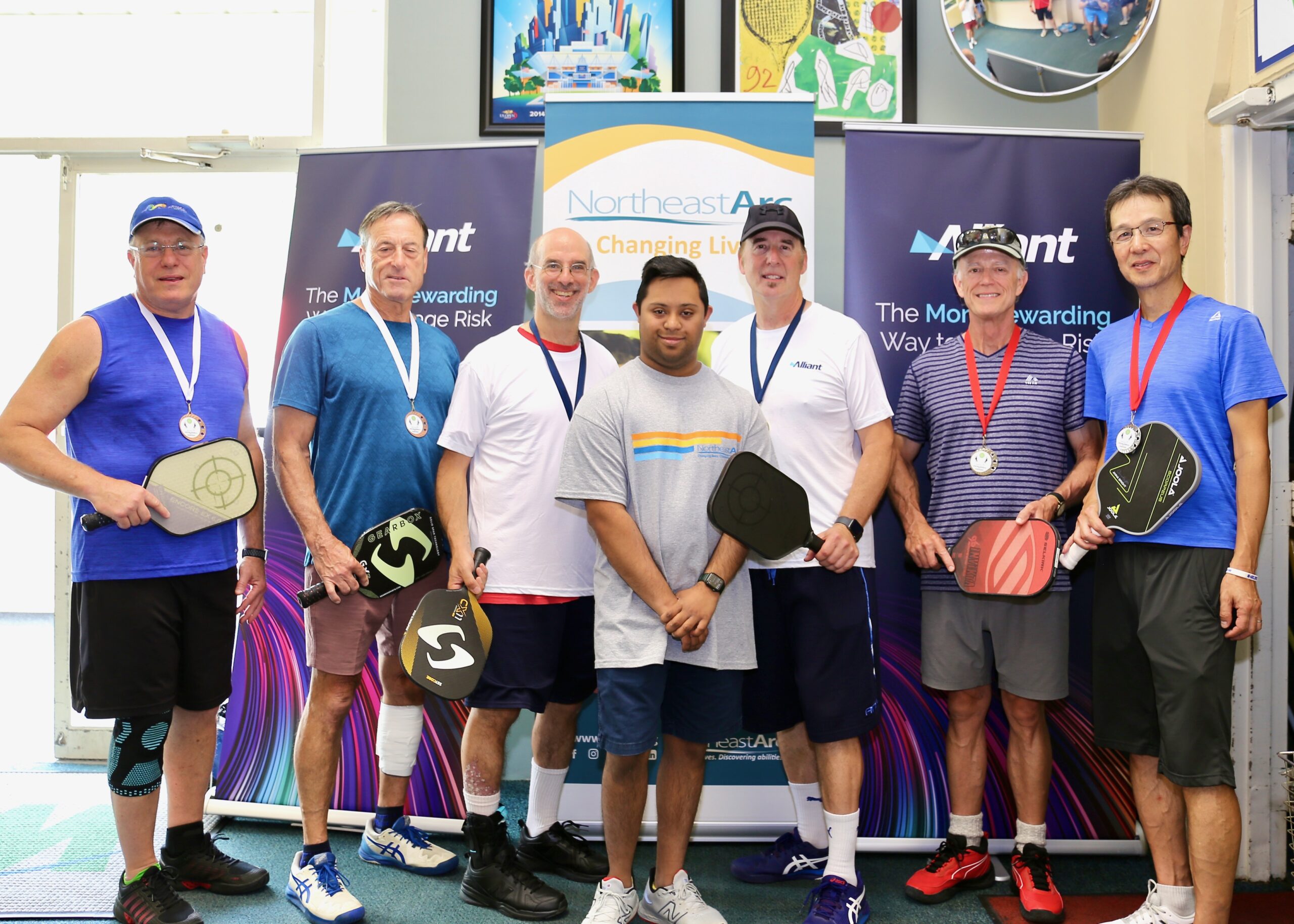 A group of men with their pickleball medals.