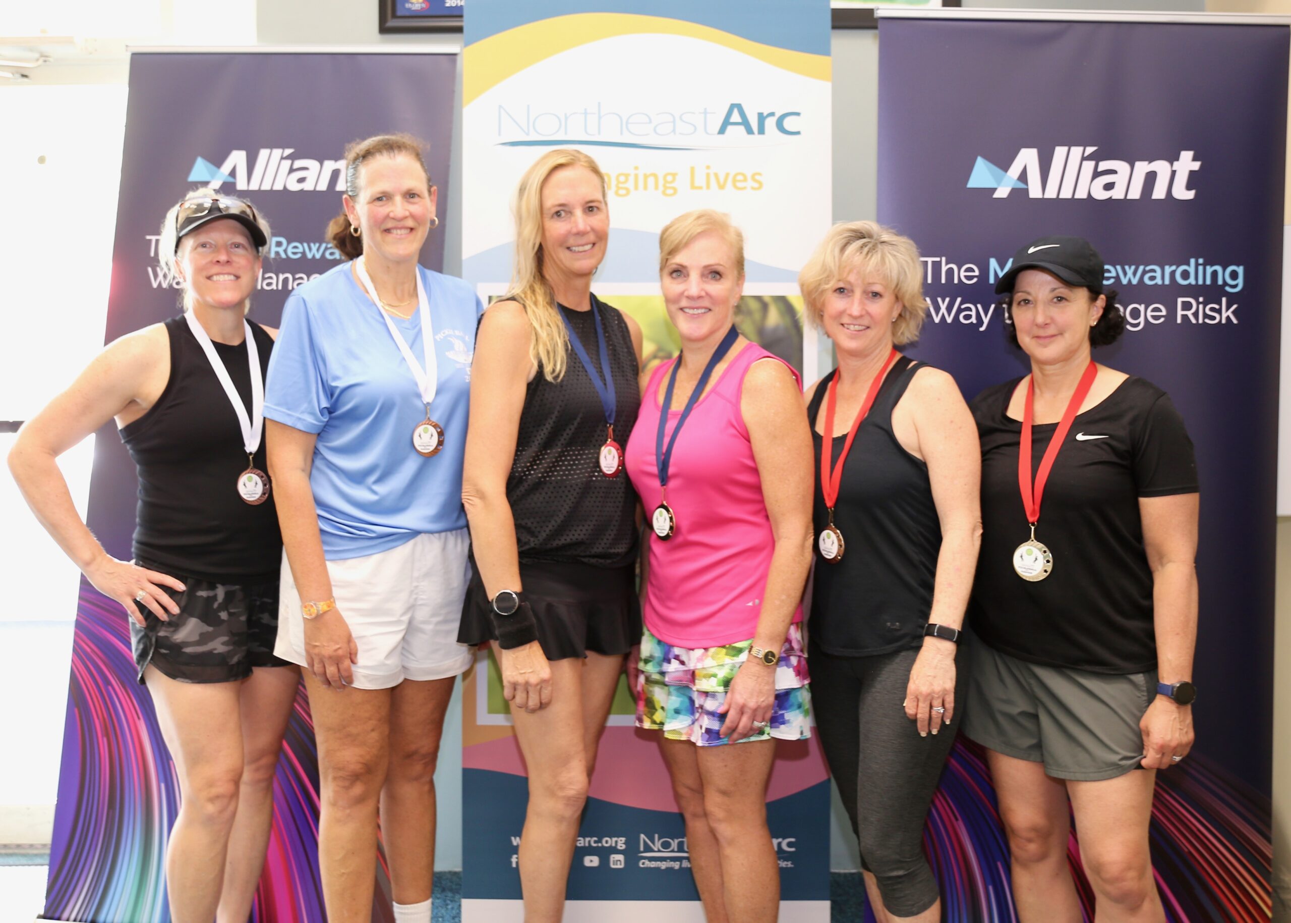 A group of women with their pickleball medals.